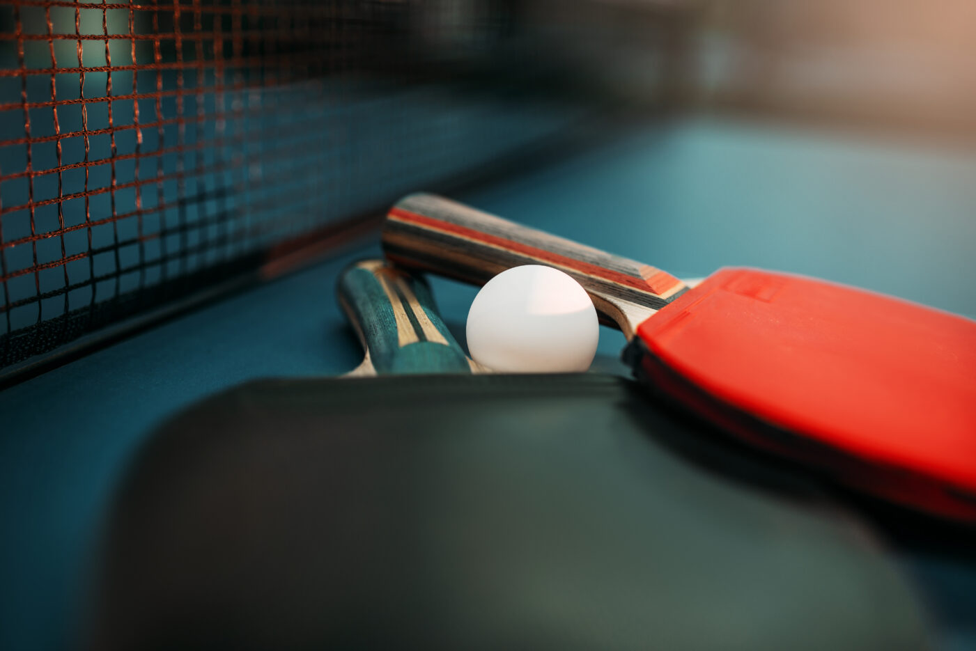 Tennis rackets and ball on the table, game concept